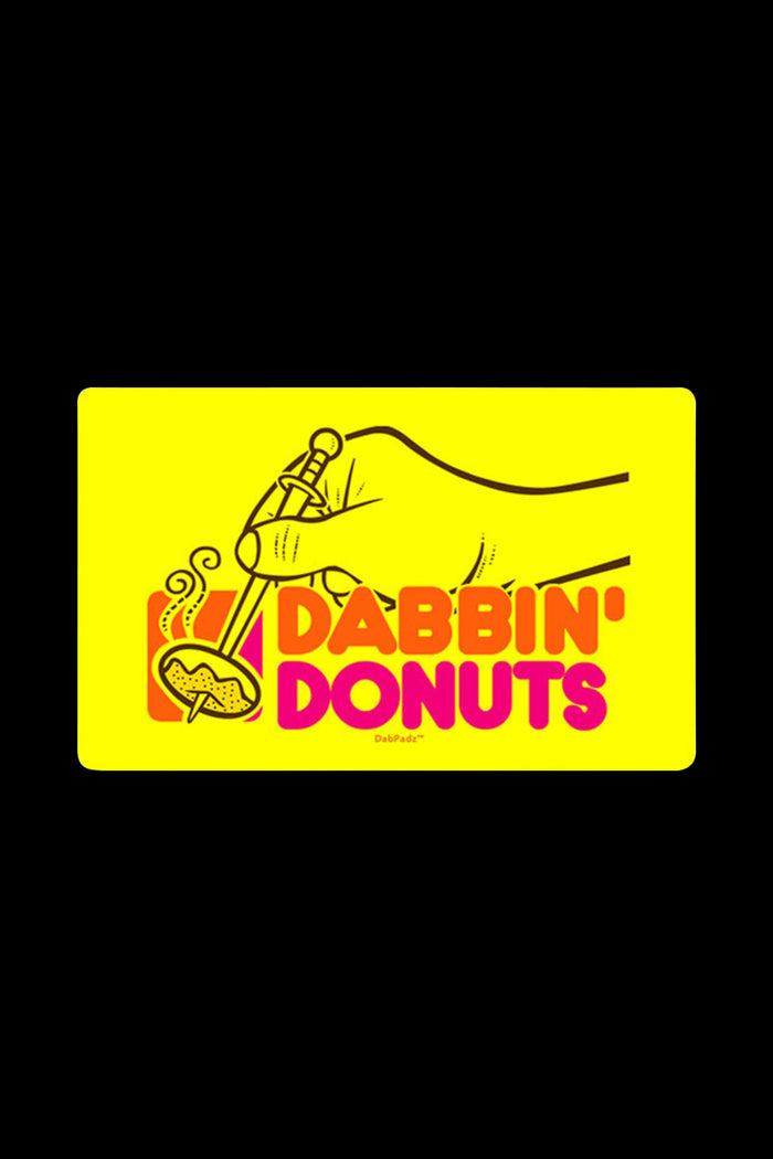 Overhead view of the DabPadz "Dabbin Doughnuts" Large Dab Mat featuring a colorful doughnut design on a dark background.