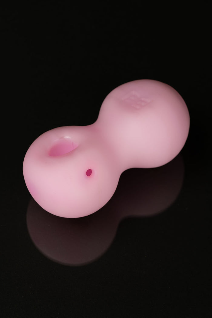 Pink glass bubbler for smoking cannabis.