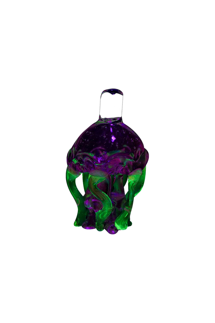 A vibrant, top-down view of the Empire Glassworks UV Jellyfish Carb Cap, showcasing its translucent, colorful design.