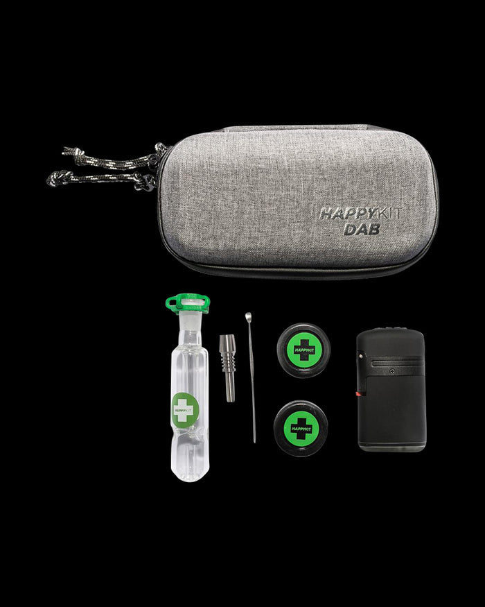 Front view of The Happy Dab Kit, a small, black portable case with a reflective surface, centered against a dark background.