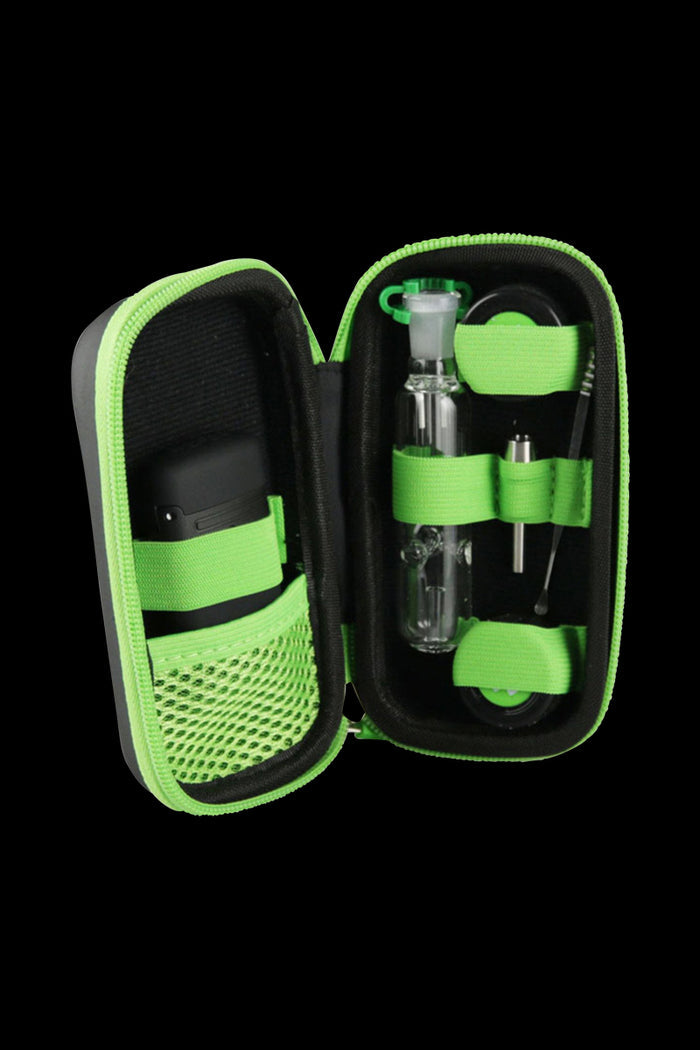 Open view of The Happy Dab Kit, displaying a clear glass attachment and silicone accessories inside a black carrying case.