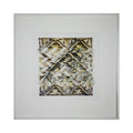The artwork 'Indirection' by Kiana Honarmand features an intricate geometric pattern of hand-cut and woven giclee prints. The composition displays overlapping diagonal lines creating X-shaped motifs in muted gold, beige, and gray tones. The textural layering effect produces a complex, abstract design with weathered, vintage-like qualities, framed in crisp white matting and a minimalist silver frame.