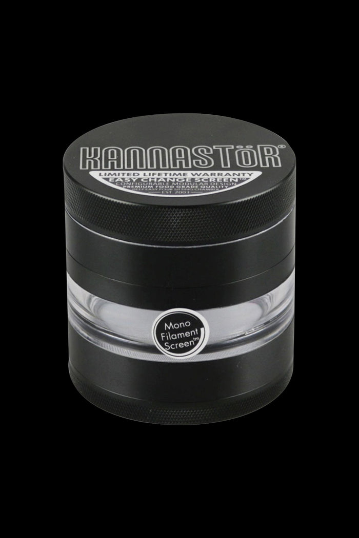A close-up, angled view of the Kannastor 2.5" 4-Piece Grinder, showcasing its metallic finish and circular design.