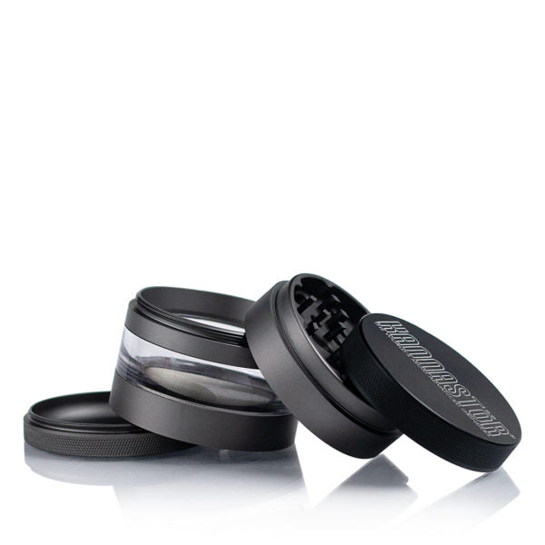 A close-up, angled view of the Kannastor 2.5" 4-Piece Grinder with Monofilament EZ Screen, showcasing its metallic finish and multi-part construction.