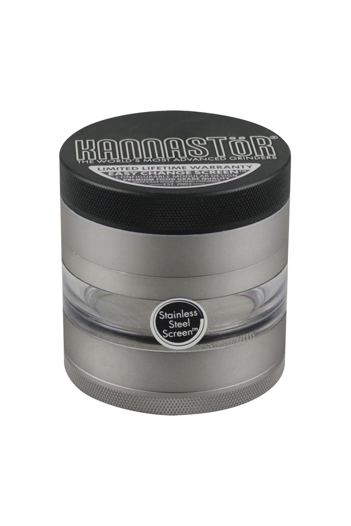 A close-up of the gunmetal Kannastor Multi Chamber Grinder, showcasing its multi-tiered design and circular shape.