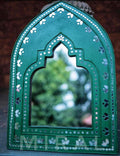 This product combines traditional Kutch Mural art with British geometric techniques and features a looking mirror at the center.