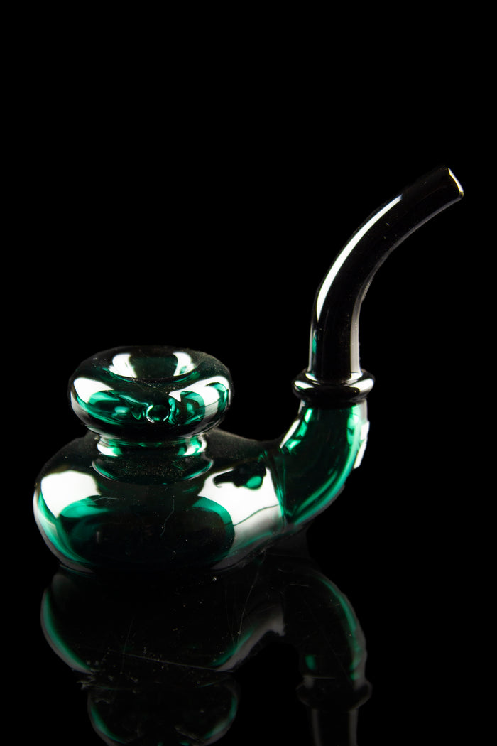 Emerald green glass water pipe against a black background.