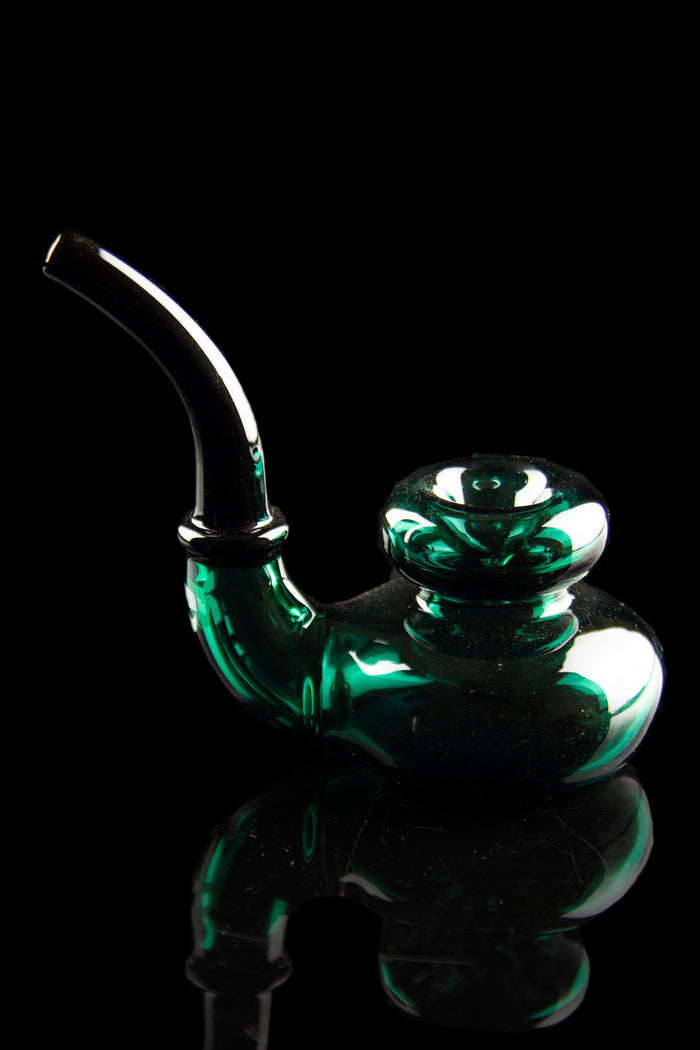 Emerald green glass water pipe against a black background.