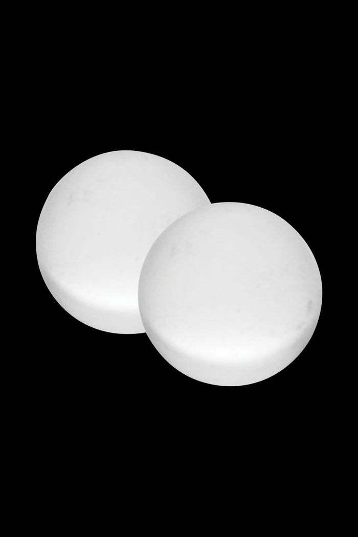 Close-up of two white spherical Pulsar Quartz Terp Beads - 2 Piece Set resting against a black background, front bead slightly overlapping the rear.