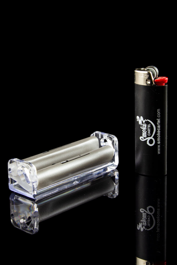 Clear acrylic one-hitter pipe and lighter with cannabis branding.