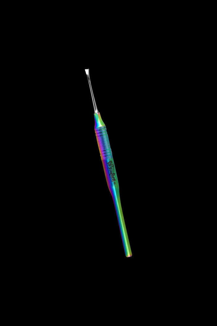 Angled close-up of a rainbow-finish Skilletools Anodized Series Dab Tools Flexy against a black background, showing textured grip and flattened tip