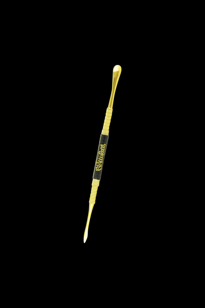 A studio shot of the Skilletools Gold Series Dab Tools, showcasing the sleek gold metal tool angled against a dark backdrop.