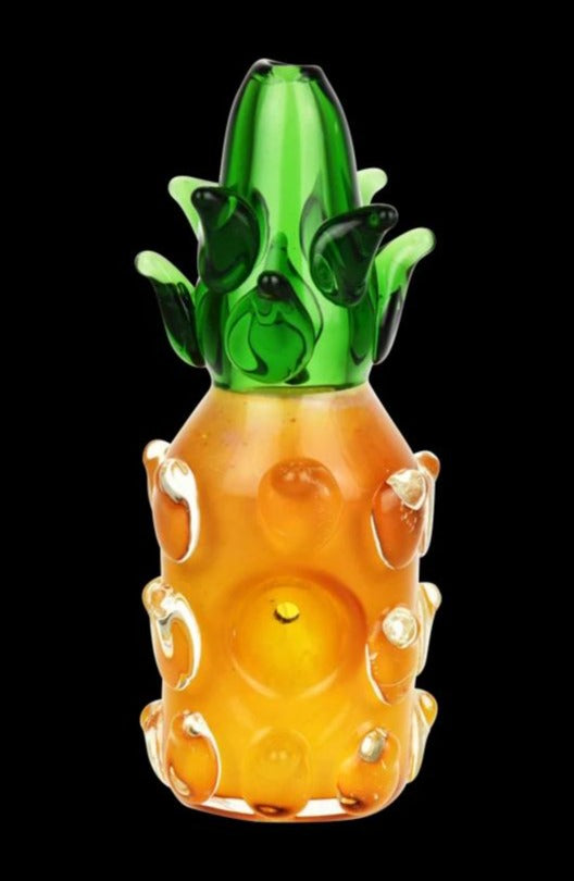 A front view of the Spoon Hand Pipe - The Pineapple, showcasing its textured, green and clear glass design.