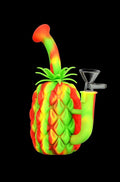 Angled studio view of The Pineapple Bong - Silicone Bong with Glass Bowl in neon red, yellow, and green against a black background.