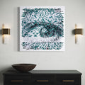 The artwork 'The Price of Choice' by Kiana Honarmand features a striking digital-style eye rendered in teal and black pixelated elements. The composition shows a detailed human eye emerging from a mosaic of geometric fragments, created through hand-cut and woven giclee prints on a white background, measuring 28x28 inches. By Kiana Honarmand.