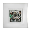 The artwork 'The Three Graces' by Kiana Honarmand features a woven photo collage with geometric pixelated patterns in black, white, and mint green. Hand-cut giclee prints create a mesmerizing abstract mosaic effect with vertical stripes and zigzag patterns, framed in clean white matting. 16x16 inches contemporary wall art.
