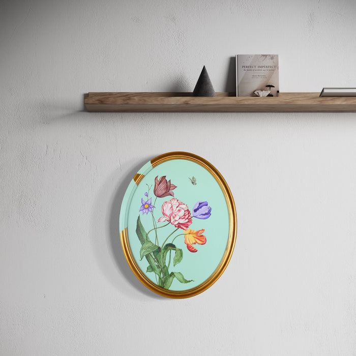 The artwork 'Tulips and Wings II' by Carlos Gamez de Francisco features delicate tulips in pink and purple hues against a serene mint-green background, surrounded by fluttering butterflies in orange and blue tones. The oval-shaped canvas is framed in elegant gold, showcasing botanical artistry in acrylic on a 16x20 inch canvas.
